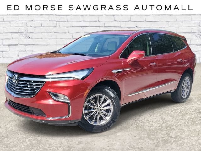 2024 Buick Enclave Essence in Cherry Red Tintcoat — front three-quarter view